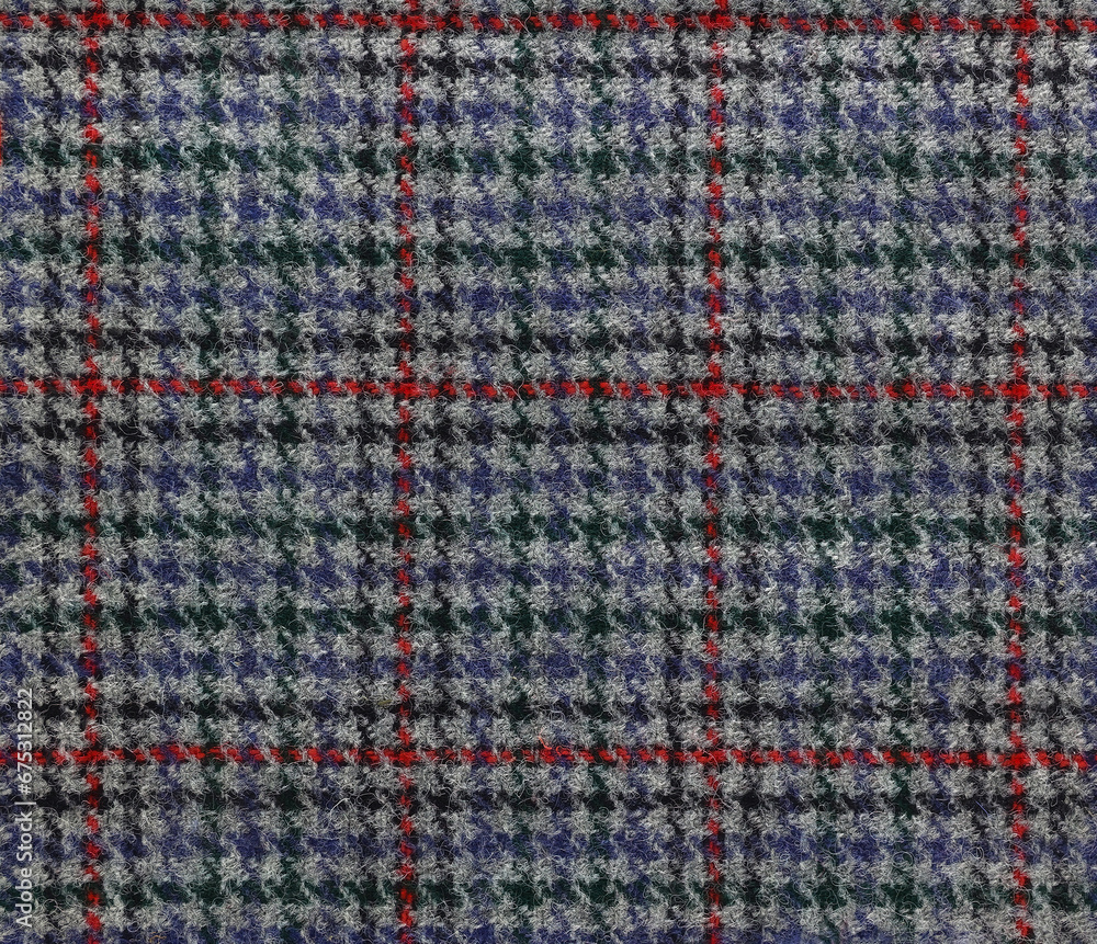 Houndstooth tartan pattern on a wool fabric in grey red and blue
