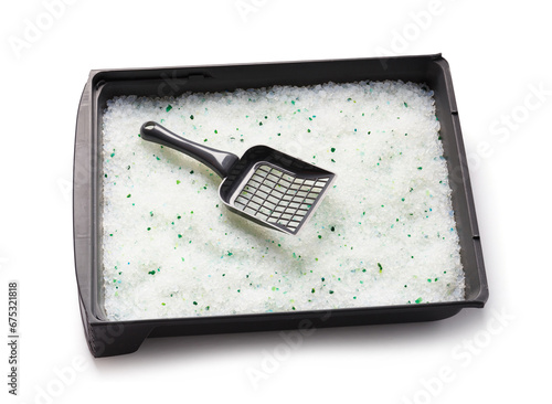 Fototapeta Naklejka Na Ścianę i Meble -  Cat litter box, gray tray filled with silica gel crystals and a cleaning shovel on a white background, top view.