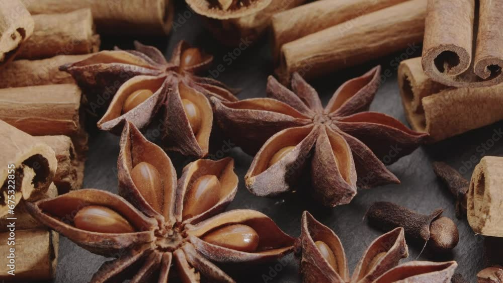 Lots of three spices for mulled wine – star anise, cinnamon and clove slowly scroll clockwise, macro video footage. Great background for your projects. Lots of three spices for mulled wine – star anise, cinnamon and clove slowly scroll clockwise, macro video footage. Great background for your projects.