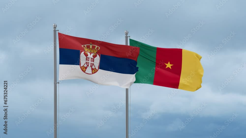 Cameroon flag and Serbia flag waving together on cloudy sky, endless seamless loop, two country relations concept Cameroon flag and Serbia flag waving together on cloudy sky, endless seamless loop, two country relations concept