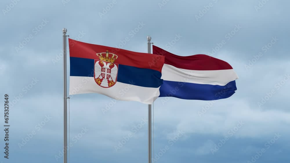 Netherlands flag and Serbia flag waving together on cloudy sky, endless seamless loop, two country relations concept Netherlands flag and Serbia flag waving together on cloudy sky, endless seamless loop, two country relations concept