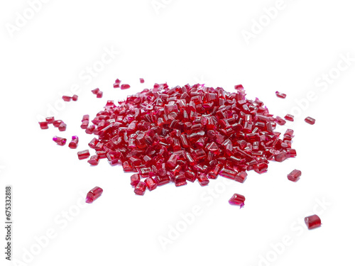 transparent red polycarbonate masterbatch granules isolated on a white background, this polymer is a colorant for products in the plastics industry