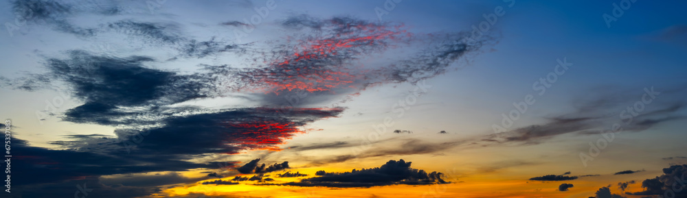 Fototapeta premium panorama Sunlight with dramatic sky on dark background.Fantasy Landscape Vivid sky on dark cloud.