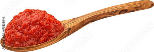 Tomato paste in wooden spoon isolated on white background photo