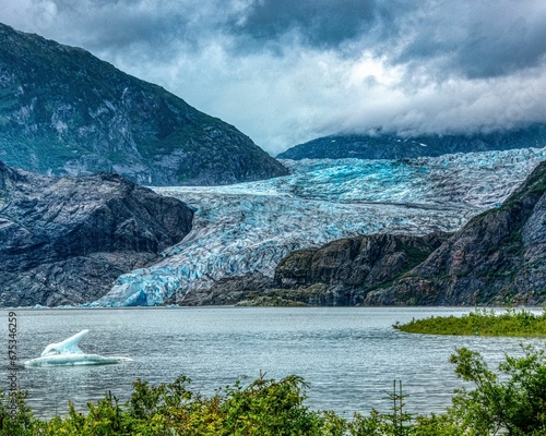 Mendenhall Glacier in Juneau, Alaska surrounded by majestic mountains