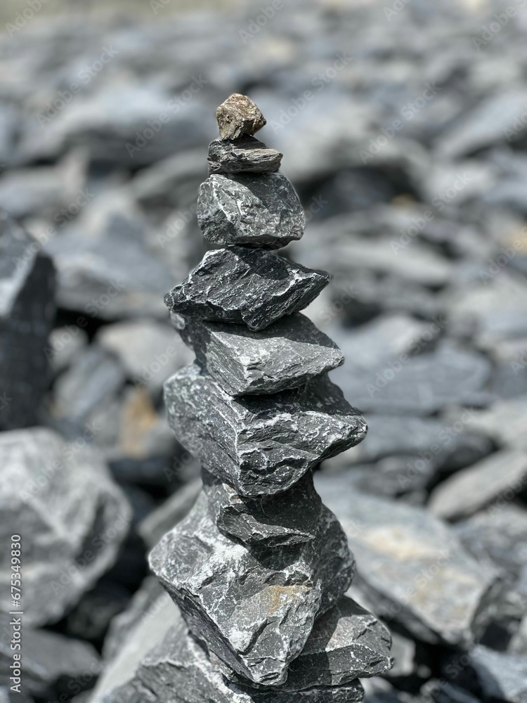 Vertical closeup of a rock tower on pebbles Vertical closeup of a rock tower on pebbles