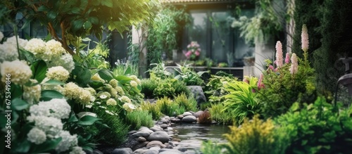 In the summer the garden is filled with the fresh scent of nature as green leaves and vibrant plants create a natural oasis for outdoor enthusiasts © TheWaterMeloonProjec