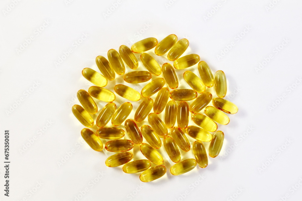 fish oil or linseed oil vitamin pills,gelatin capsule or tablet for health,heart health,medical,ayurvedic,phrmacy,naturopathy related concept in white background,top view,copy space fish oil or linseed oil vitamin pills,gelatin capsule or tablet for health,heart health,medical,ayurvedic,phrmacy,naturopathy related concept in white background,top view,copy space