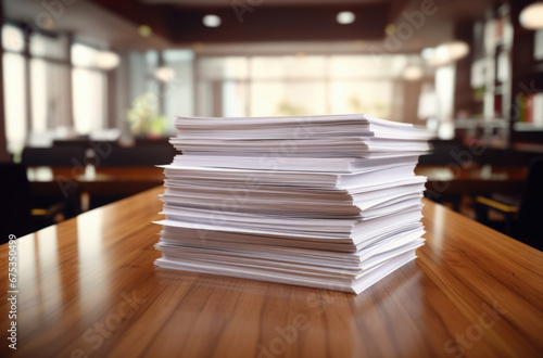 Stack of blank paper on wooden table indoors © Ruslan Gilmanshin
