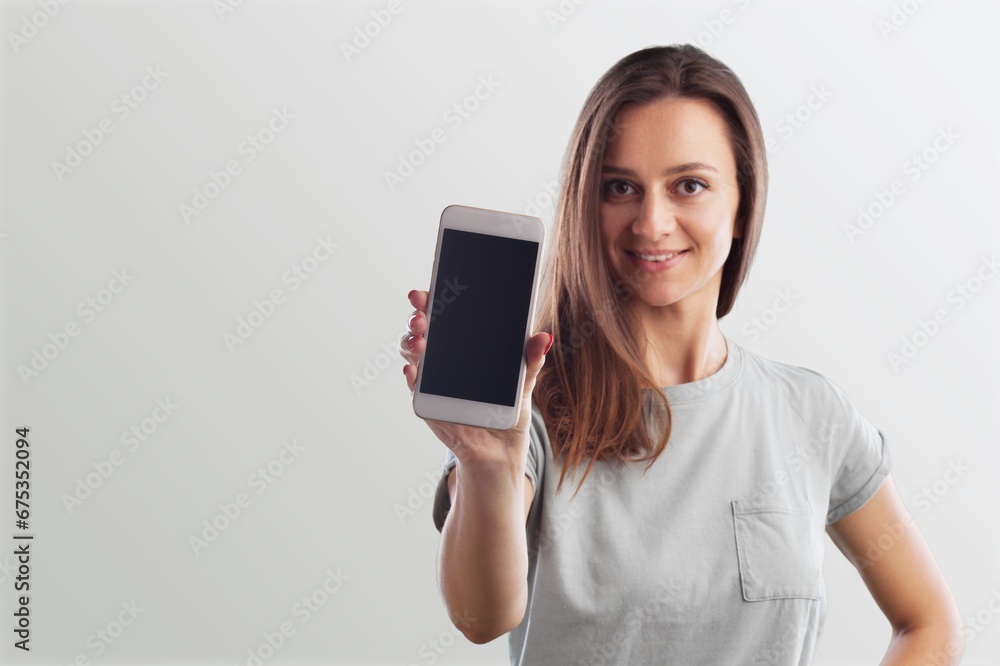 Happy beautiful young woman hold mobile phone