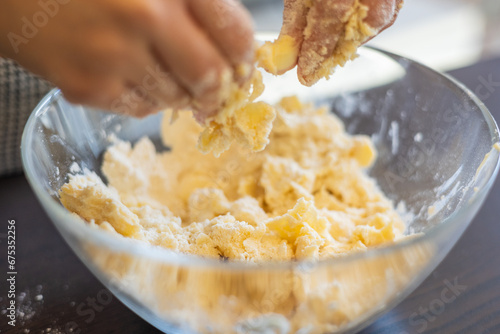 Creative Culinary Fun: Kid's Hands Crafting Raw Shortcrust for Mini Tarts