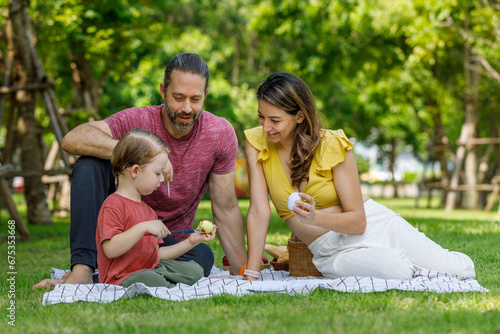 Happy family day, father, mother, son, Caucasian enjoying watercolor painting and picnic in nature.