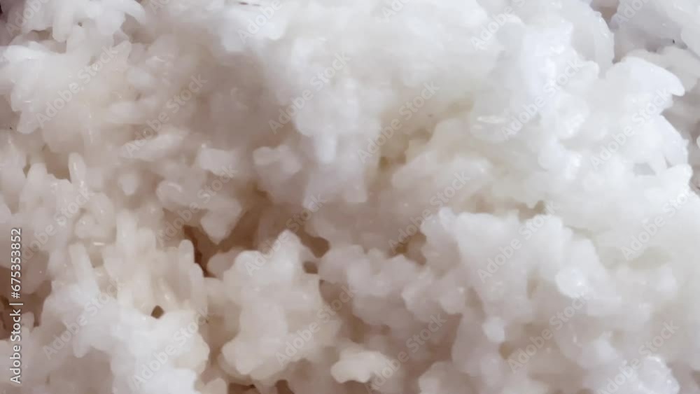 Steaming white cooked rice, cooking food and recipe ingredient, slow motion Steaming white cooked rice, cooking food and recipe ingredient, slow motion