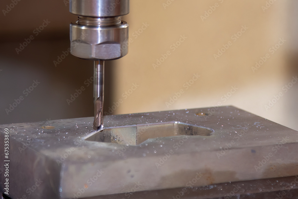 The CNC milling machine cutting  mold part by solid ball end mill tool.