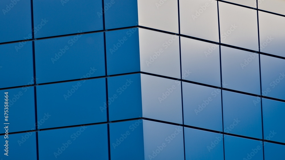Abstract geometric rectanle background. Building facing exterior. Side light makes amazing blue structure. Abstract geometric rectanle background. Building facing exterior. Side light makes amazing blue structure.