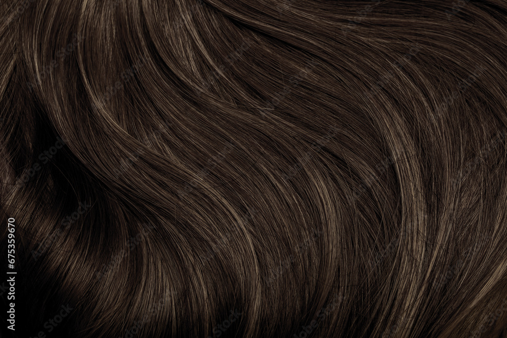 Brown hair close-up as a background. Women's long brown hair. Beautifully styled wavy shiny curls. Hair coloring. Hairdressing procedures, extension. - obrazy, fototapety, plakaty 