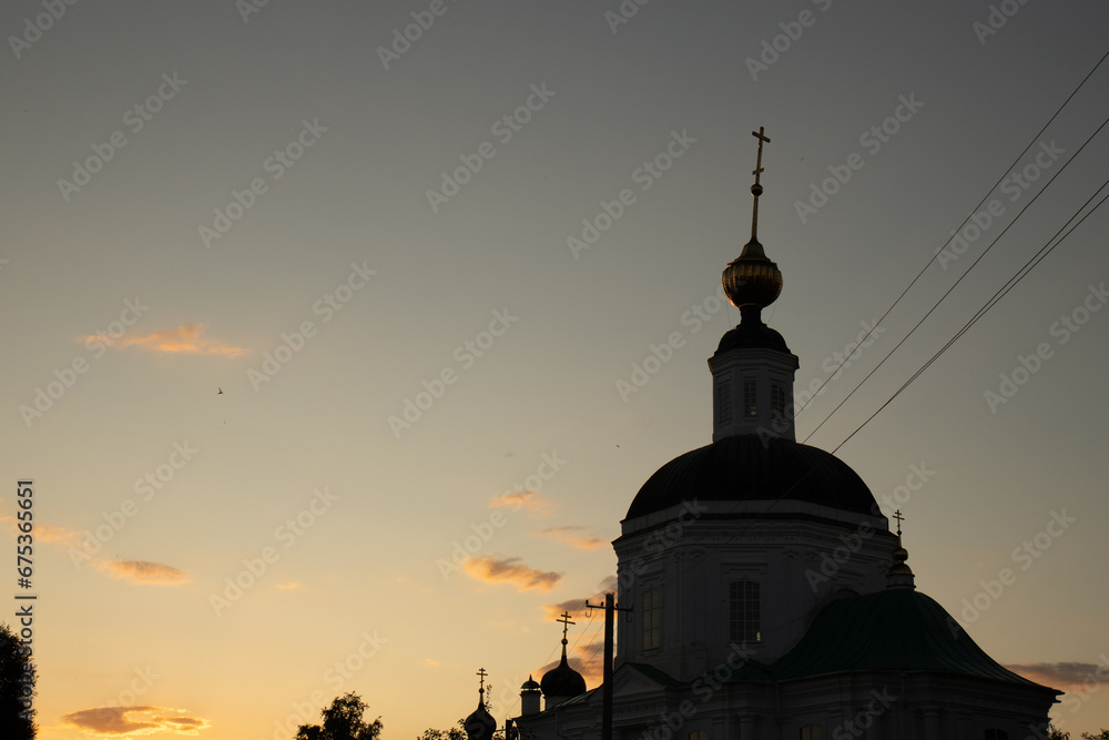 The outline of the temple against the background of the sunset sky.