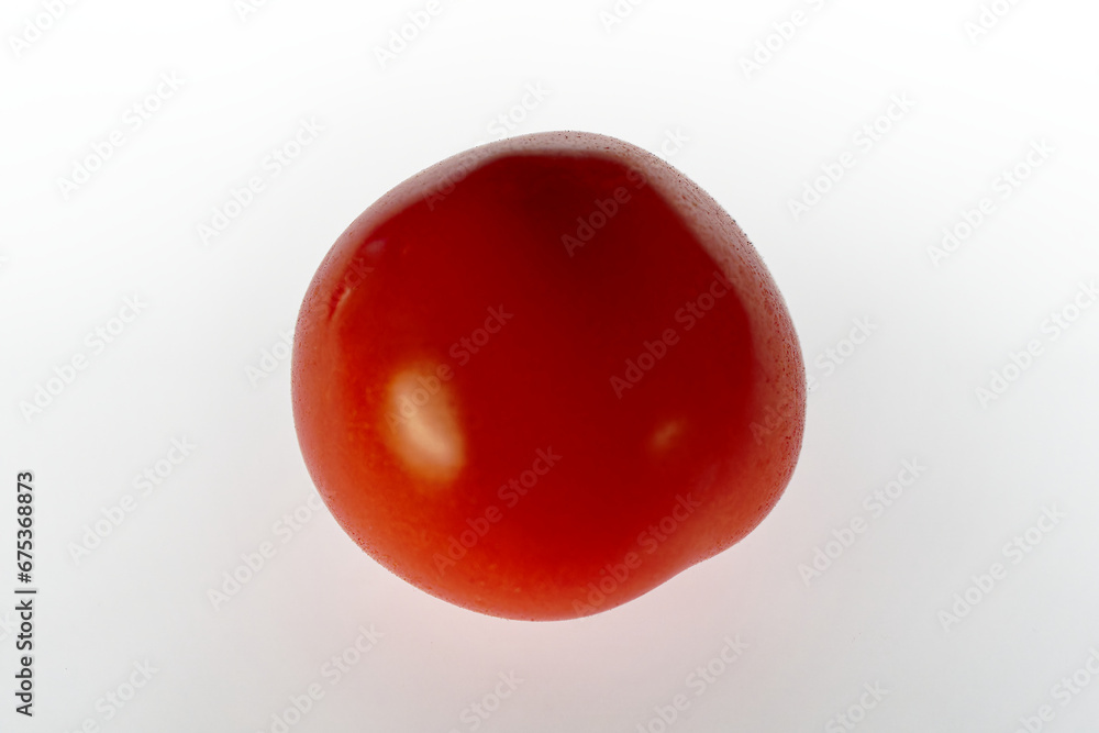 Close-up of red tomato with reflections against white illuminated background . Photo taken November 8th, 2023, Zurich, Switzerland. Close-up of red tomato with reflections against white illuminated background . Photo taken November 8th, 2023, Zurich, Switzerland.