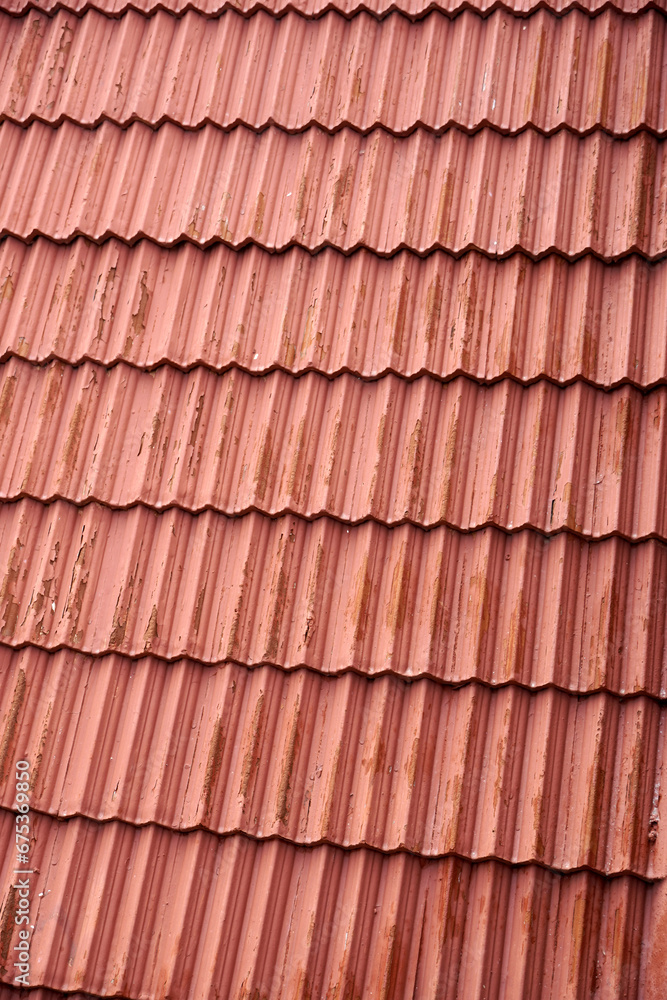 Red roof tiles texture. Closeup of tiles on the roof surface. Red roof tiles texture. Closeup of tiles on the roof surface.