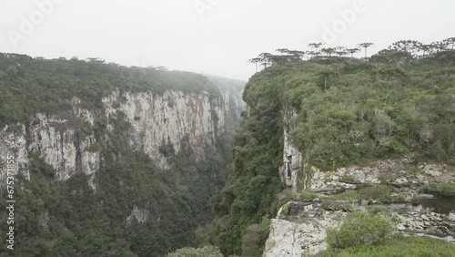 Itaimbezinho canyon at the Aparados da Serra National Park, located in the Serra Geral range of Rio Grande do Sul and Santa Catarina between coastal forests, grasslands and Araucaria moist forests. photo
