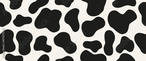 Vector illustration. Cow texture pattern. Animal skin pattern. Spots of black color on a white background. Ideal for textile design, screensavers, covers, cards, invitations and posters.