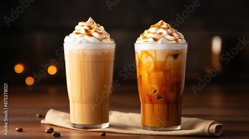 Iced pumpkin spice and caramel latte with whipped cream and syrup.