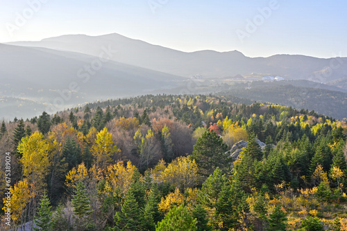 autumn landscape in the mountains. Uludag mountainsummit ski resort autumn view in October. Nature landscape at fantastic sunset. Green mountains in autumn and fried clouds in the sky. Uludag mountain