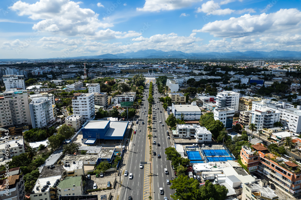 Fototapeta premium Beautiful aerial view of the city of Santo Domingo - Dominican Republic with is Parks, buildings, suburbs ,turquoise Caribbean ocean, parks and malecon