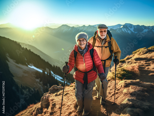 A photo of an elderly couple on a hike up the mountain.