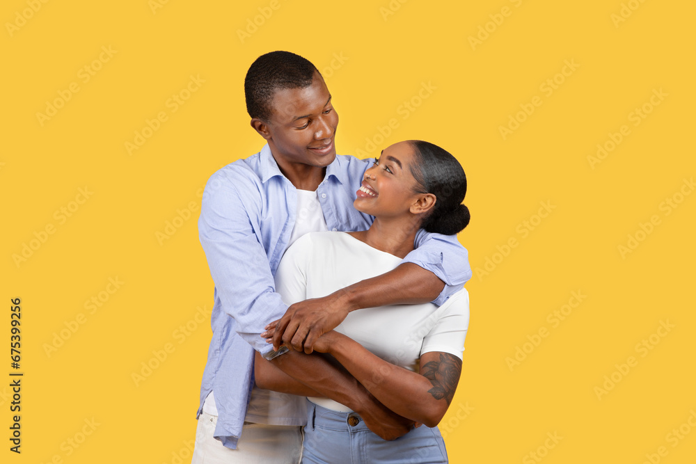 Loving couple embracing with a joyful expression Loving couple embracing with a joyful expression