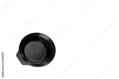 Black plastic bowl for hair coloring on white background. Accessories for hair coloring. Tool stylist for hair.