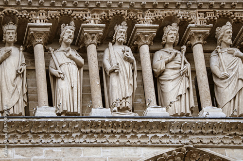 Notre dame entrance portal's decorations Saints sculptures detail, Paris France.