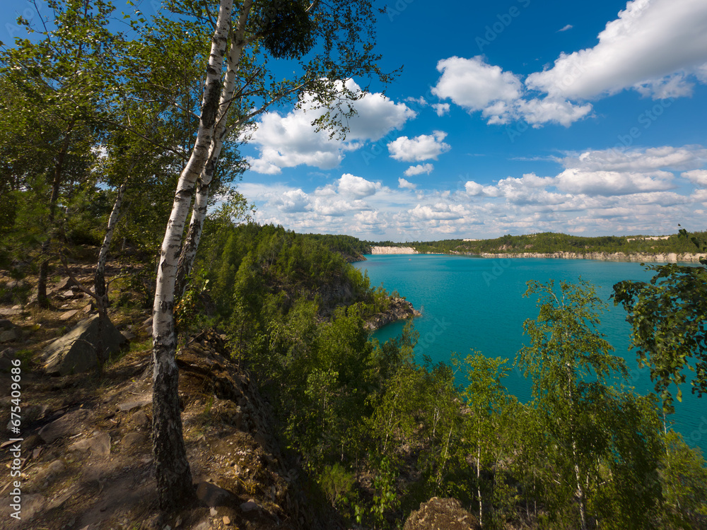 Lake landscape with turquoise water summer sunny day
