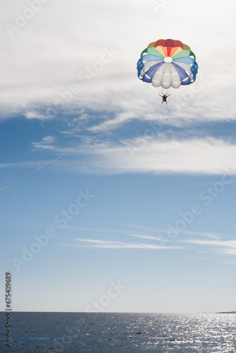 Parasailing Bliss: Soaring High in the Sky on a Sunny Day