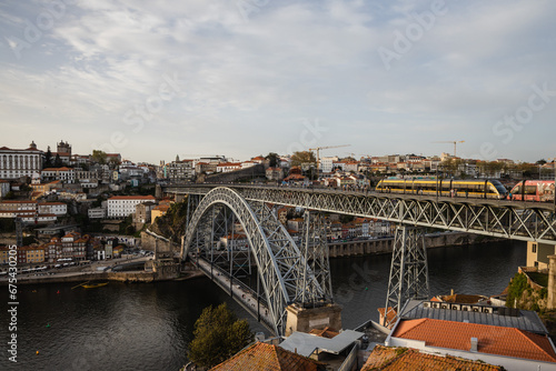 Panoramic view of Porto with Duoro river on a cloudy day, Porto cityscape © olly_plu