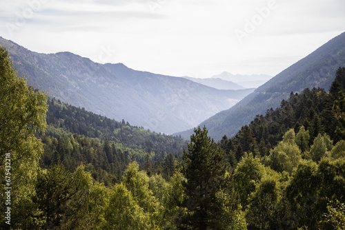 Beautiful landscape of the natural park of Aigüestortes y Estany de Sant Maurici, Pyrenees valley with river and lake