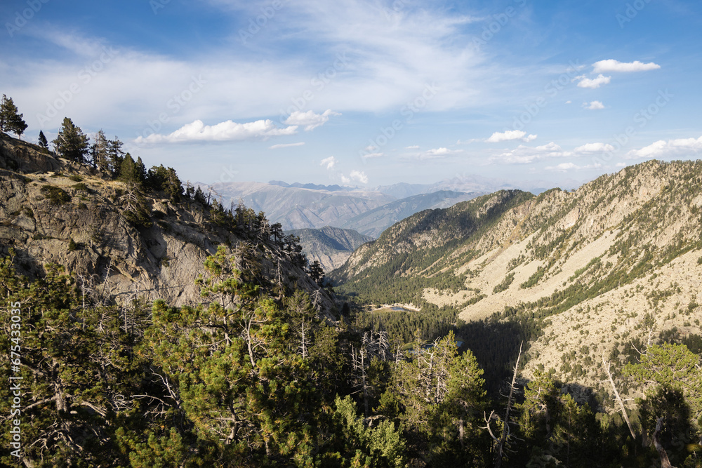 Naklejka premium Beautiful landscape of the natural park of Aigestortes y Estany de Sant Maurici, Pyrenees valley with river and lake