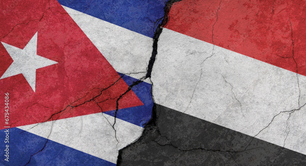 Naklejka premium Cuba and Yemen flags, concrete wall texture with cracks, grunge background, military conflict concept