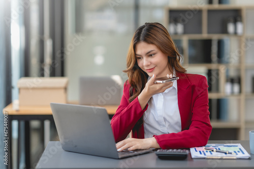 Young businesswoman making a professional phone call in her office...