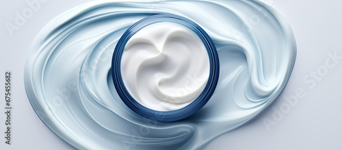 The white background beautifully isolates the blue texture of the face mask enhancing its cosmetic benefits for skin care and hair beauty in this medicine infused cream photo