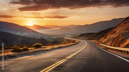 Scenic curved highway asphalt road with golden sky and mountain in the sunset © Zahid