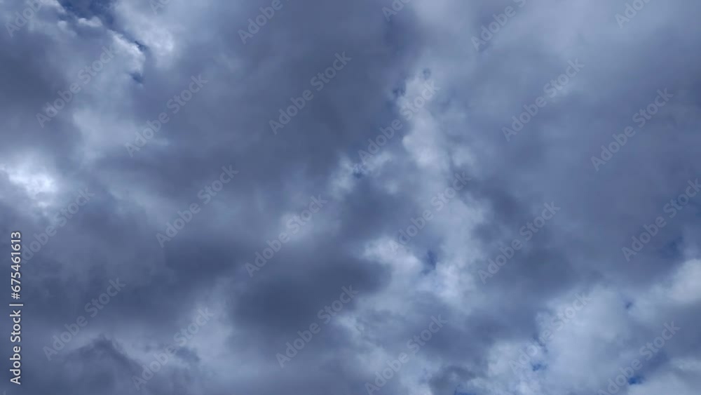 Illuminated sky with clouds of sombre tones circulating through the sky Illuminated sky with clouds of sombre tones circulating through the sky