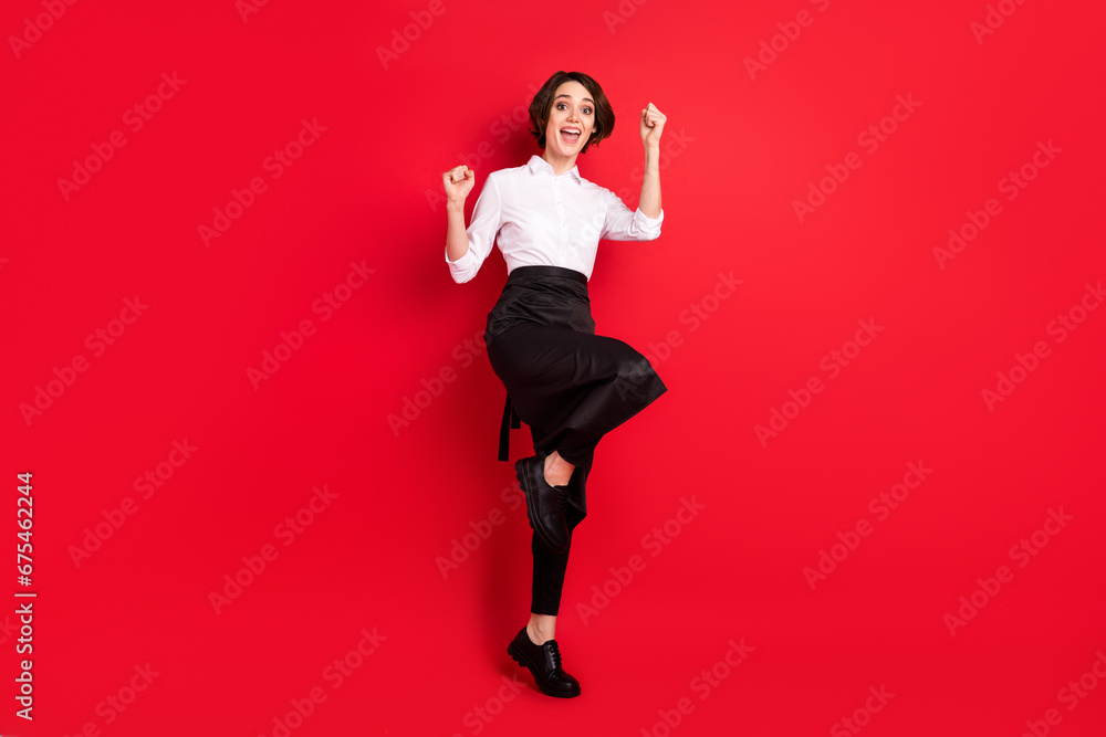 Full size photo of hooray nice brunette hair lady hands fists wear shirt isolated on red color background