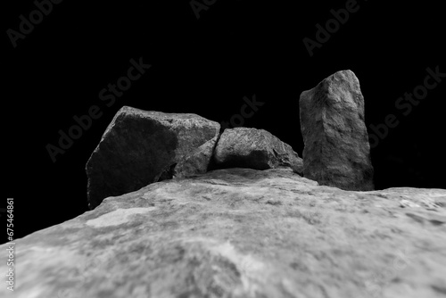 A Wide Angle of a Rock for a Product Display, Showing a Blurred Foreground Leading to a Middle Stone with a Light Shadow on the Natural Textured Surface.