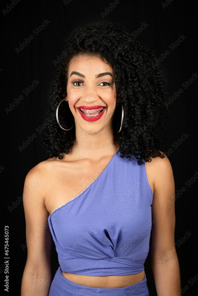 Young beautiful woman, smiling, wearing blue outfit. Young beautiful woman, smiling, wearing blue outfit.