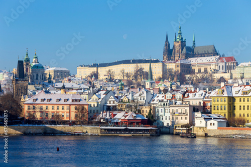 Snowy Prague Lesser Town with Prague Castle above River Vltava in the sunny Day   Czech republic