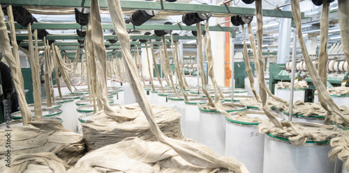 Industrial loom on textile .Flax processing plant, fabric production. Flax is made .A workshop at a textile factory.