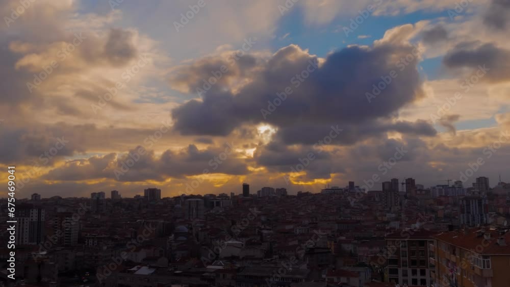 Timelapse: dramatic sunset sky with the setting sun and moving clouds over the city of Istanbul, Turkey in the evening - buildings silhouettes, getting darker. Time lapse, urban, and cityscape concept Timelapse: dramatic sunset sky with the setting sun and moving clouds over the city of Istanbul, Turkey in the evening - buildings silhouettes, getting darker. Time lapse, urban, and cityscape concept