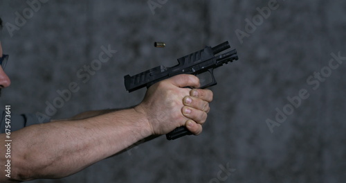 Photography Close-up pistol Stoeger STR-9 Striker Fired 9mm, single shot at shooting range i