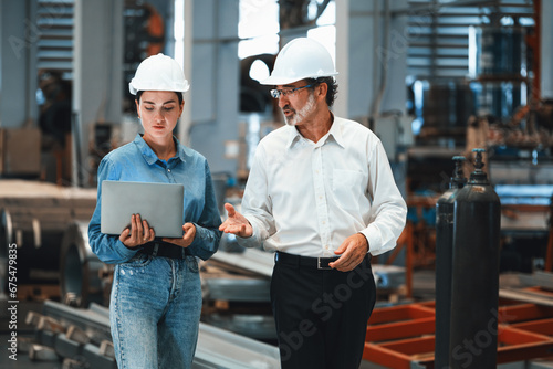 Factory manager or executive make visit metalwork manufacturing factory tour and inspect heavy steel industrial machinery showcase leadership quality as engineering inspection supervisor. Exemplifying